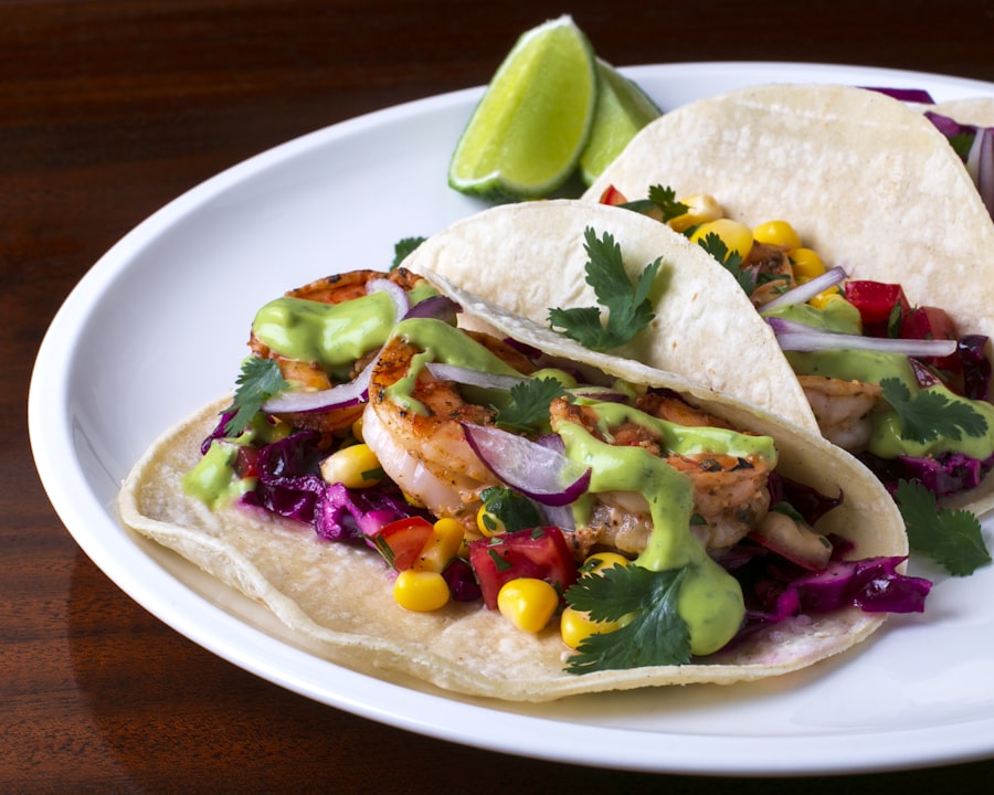 Three tacos with grilled fillings on blue corn tortillas